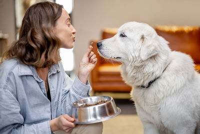 Side view of woman with dog