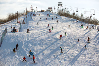 Low angle view of people on ski slope