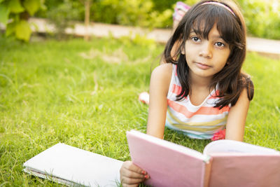 Portrait of young woman using laptop