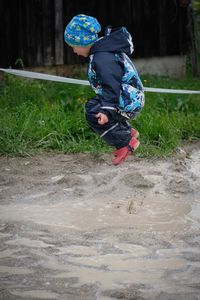 Full length of a boy running on land