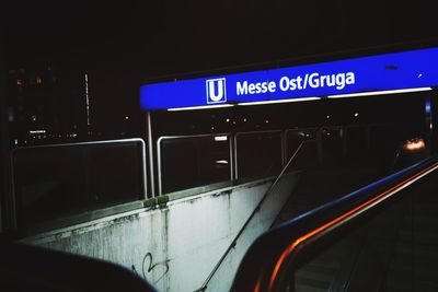 Illuminated text on car in city at night