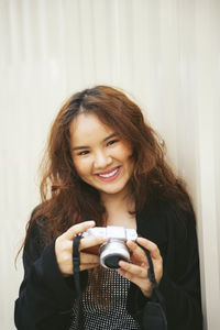 Portrait of smiling young woman