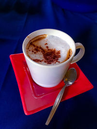 Close-up of coffee cup on table