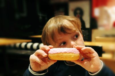 Close-up of boy holding sweet food