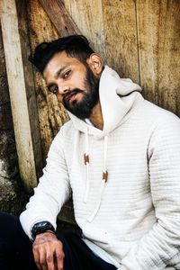 Portrait of man sitting outdoors