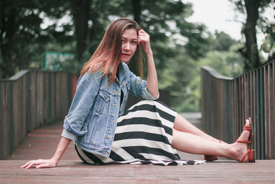 Portrait of woman sitting outdoors