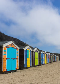 Beach huts against sky