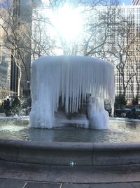 Fountain in park during winter