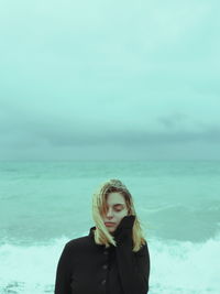 Close-up of woman standing against sky