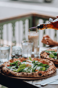 Close-up of pizza served on table