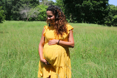 Young woman standing on field