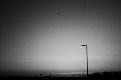 Low angle view of street light against sky at night