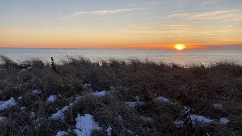Scenic view of sea against sky during sunset