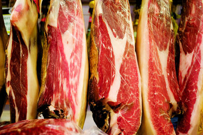 Spanish cured ham hanging in a market