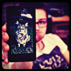 Close-up of man using mobile phone