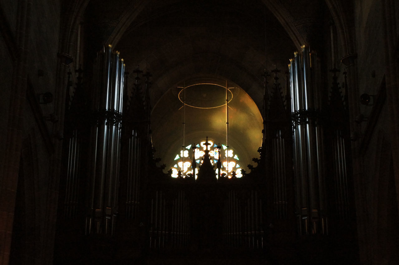 LOW ANGLE VIEW OF ILLUMINATED CHANDELIER AT BUILDING