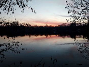 Scenic view of lake against sky during sunset