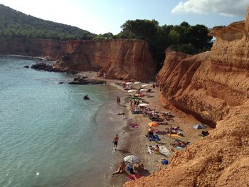 People on beach against sky