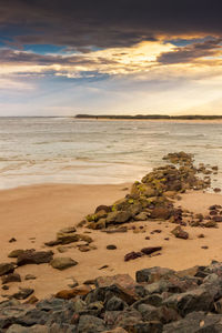 Scenic view of sea against sky at sunset