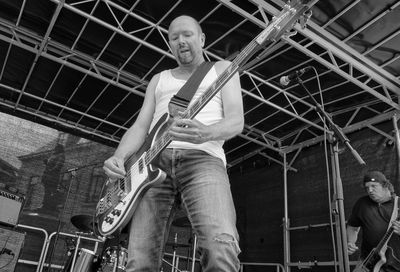 Low angle view of man playing guitar