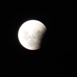 Low angle view of moon against sky at night