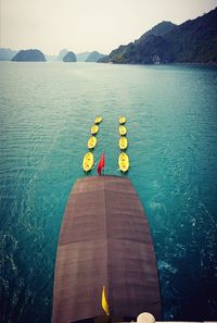 High angle view of kayaks and boat at sea