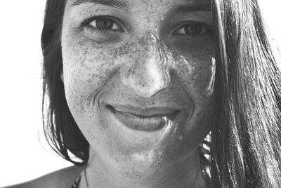 Portrait of smiling freckled woman