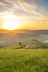 Sunrise over the hills of a rural landscape