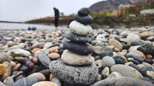 Close-up of stone stack on pebbles at beach