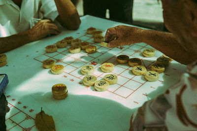 High angle view of people playing board game