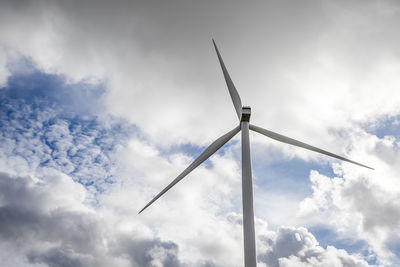 Low angle view of wind turbine against sky