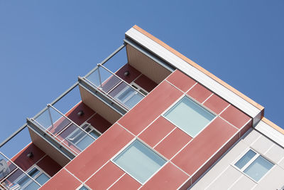 Low angle view of building against clear blue sky