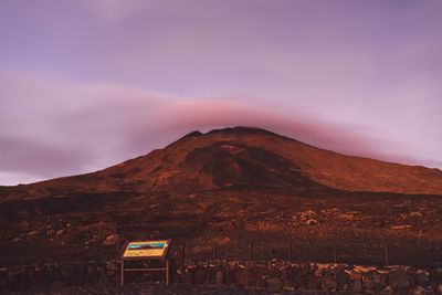 Scenic view of mountains against sky at night