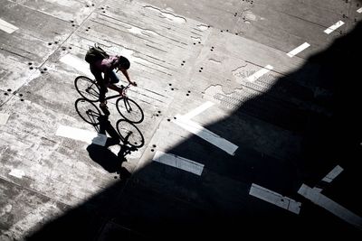 High angle view of man cycling on street