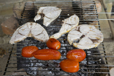 High angle view of meat on barbecue grill