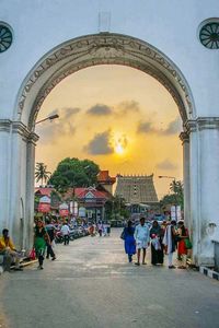 People in city at sunset