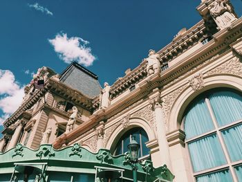 Low angle view of historical building against blue sky