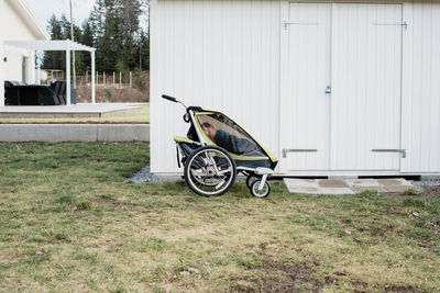 Kid sleeping in a stroller outside in sweden