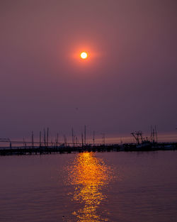 Scenic view of sea against clear sky during sunset