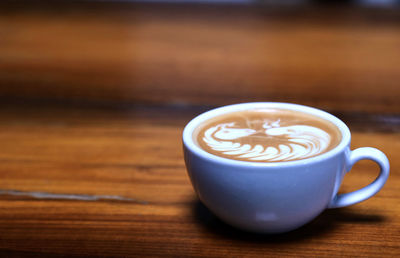 Close-up of cappuccino on table