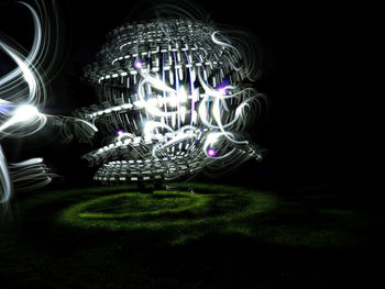 Digital composite image of light painting against black background