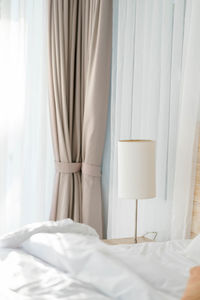 White curtain on bed at home