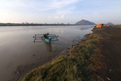 Man on boat against sky