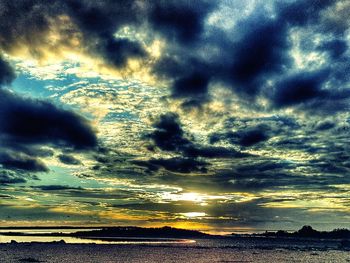 Scenic view of sea against cloudy sky