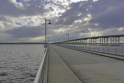 Bridge over sea against sky