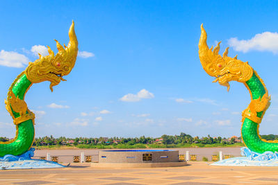 Statue against blue sky