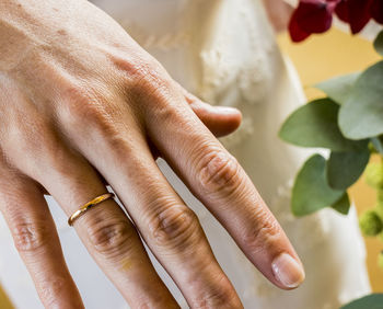 Close-up of woman hand with wedding ring