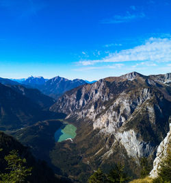 Scenic view of mountain range against blue sky