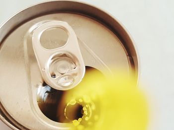 High angle close-up of drink can over white background