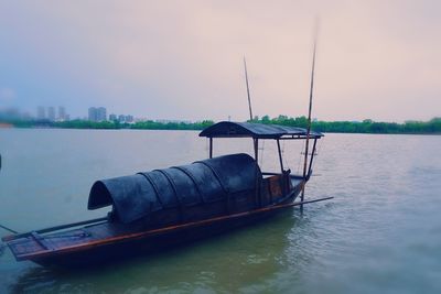 Boat in sea against sky